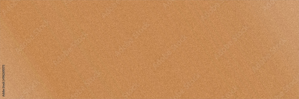 Fototapeta premium Uniform ochre grain texture with an even warm tone provides a versatile, rustic backdrop ideal for print materials, packaging designs, craft branding, and organic themed visuals.