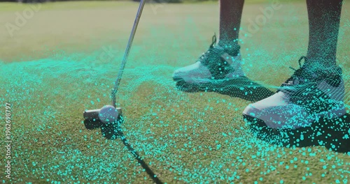 Golfer lower legs aligning putter behind ball on green, showing teal network fueling analytics