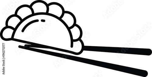 Single dumpling held by chopsticks, isolated on a grey background.