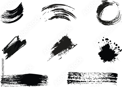 Hand drawn ink brush strokes and artistic paint textures on white background