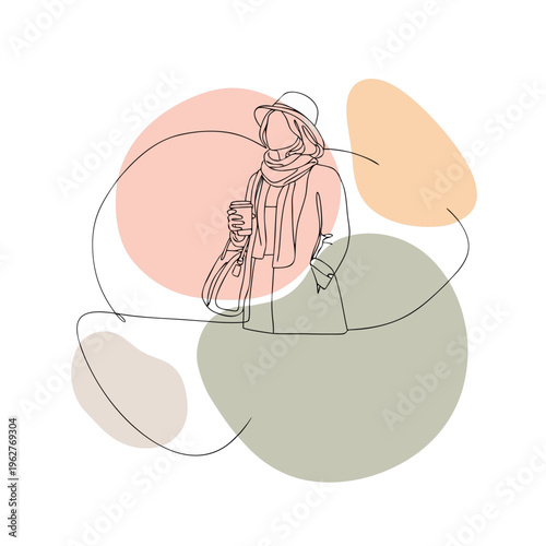 Woman holding a handbag while standing against abstract background  