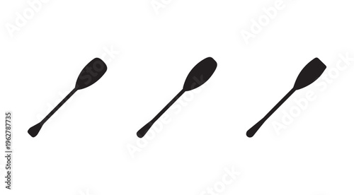 Three black kitchen silicone spatulas on white background for cooking and baking