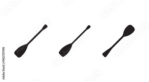 Three black kitchen spoons on white background  isolated kitchen utensils for cooking and serving food