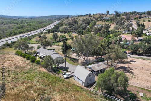 Aerial view of Fallbrook, Rainbow Crest, Rainbow Ridge with big mansion and green valley, San Diego County California