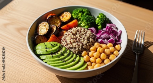 Delicious quinoa bowl filled with roasted vegetables avocado and chickpeas