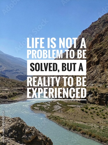  Inspirational and motivational quotes concept with nature background. Life is not a problem to be solved, but a reality to be experienced 