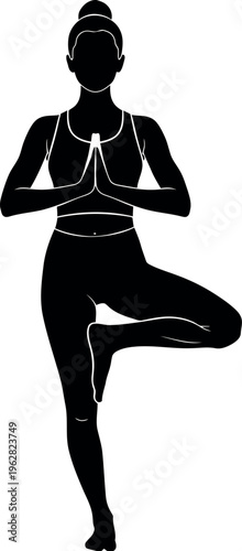 Silhouette of a woman in yoga tree pose vrksasana for balance and harmony
