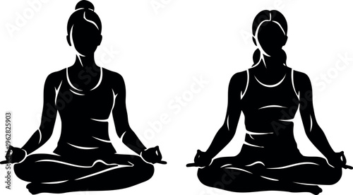 Silhouette of two women in lotus position yoga meditation pose