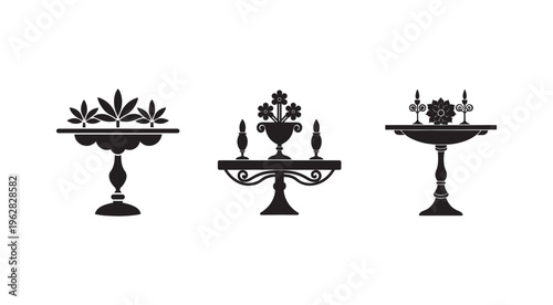 Collection of three antique ornate stands with flowers and candelabras on white background