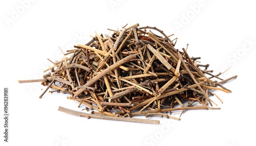 Pile of dried, thin sticks against a clean white backdrop