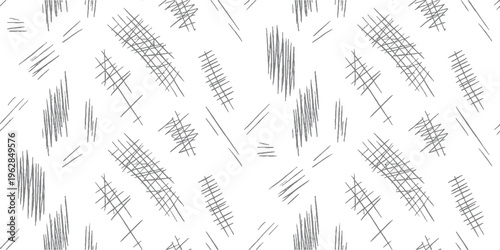Seamless pattern of hand drawn grey scribbles and crosshatch marks on white background abstract black