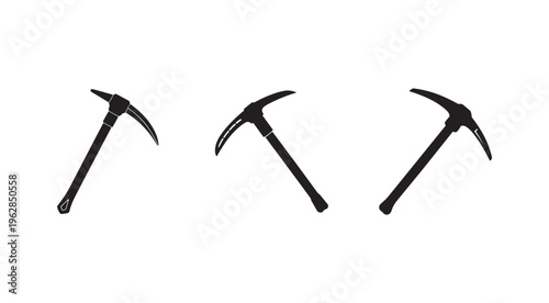 Three black pickaxes with handles and curved blades for mining or excavation work  isolated on white background