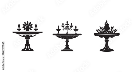 Three black silhouettes of decorative bowls with various candle and plant arrangements on white background  decorative bowls with candles and plants