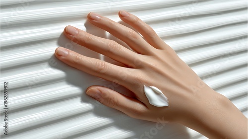 Elegant Hand with Cream on Textured Background Displaying Beauty