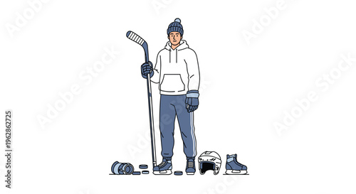A male ice hockey player stands holding a hockey stick, wearing casual clothes, with hockey equipment on the ground.