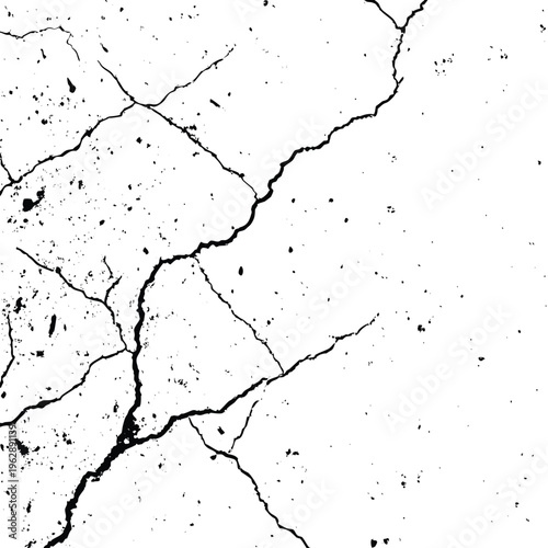 Fractured earth reveals ancient cracks and patterns beneath a stark, monochrome surface landscape