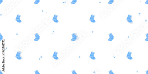 Seamless pattern of small blue socks scattered playfully on a light background.