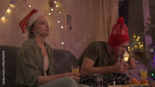 People celebrate New Year's and Christmas in a cozy home.