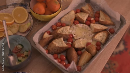Baked Camembert, mandarins, and salads—the New Year's table.