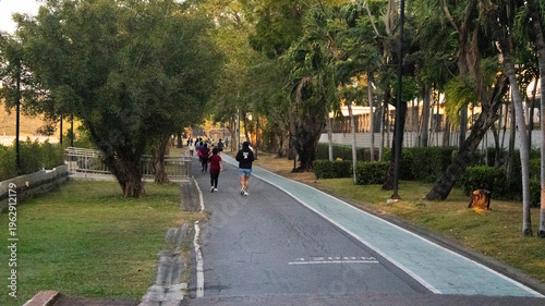 Life lifestyle thai people and fitness enthusiast training jogging and walk run exercise workout in Somdet Phra Srinagarindra Park or Suan Somdet Ya Garden on January 11, 2026 in Nonthaburi, Thailand