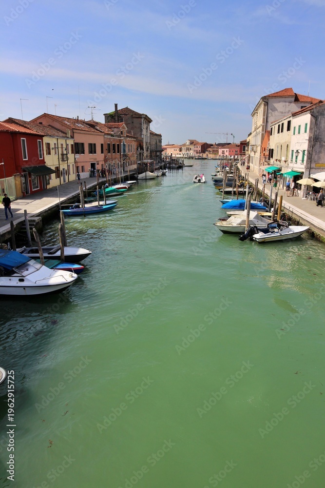 Fototapeta premium Canale di San Donato (San Donato Canal) viewed from Ponte San Donato (San Donato Bridge) in Murano, Italy