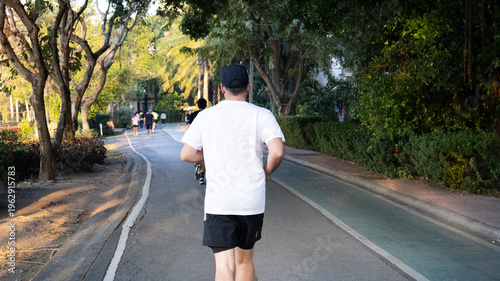 Life lifestyle thai people and fitness enthusiast training jogging and walk run exercise workout in Somdet Phra Srinagarindra Park or Suan Somdet Ya Public Garden at Pak Kret in Nonthaburi, Thailand