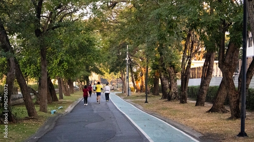 Life lifestyle thai people and fitness enthusiast training jogging and walk run exercise workout in Somdet Phra Srinagarindra Park or Suan Somdet Ya Public Garden at Pak Kret in Nonthaburi, Thailand