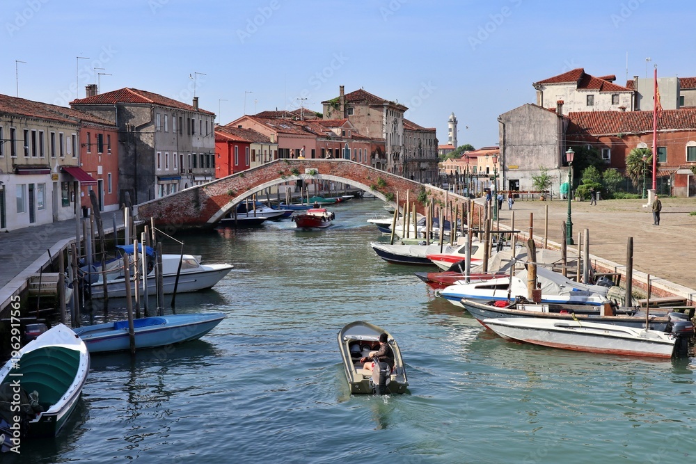 Fototapeta premium Ponte San Donato (San Donato Bridge) over Canale di San Donato (San Donato Canal) viewed from Ponte San Martino (San Martino Bridge) in Murano, Italy