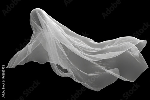 Flowing white sheer fabric with soft ripples against a stark black background