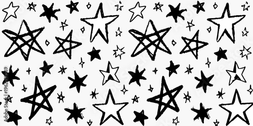 A dense pattern of hand drawn stars in black and white fills the frame