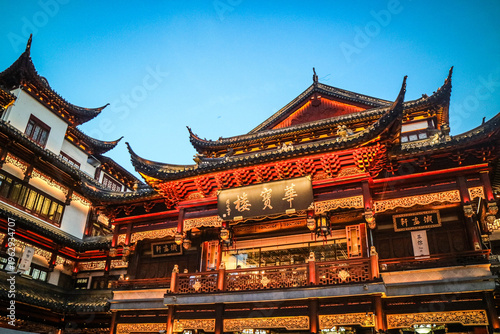 Photography Yuyuan Old Street in Shanghai, China, featuring traditional Chinese architecture, lanterns, shops, and visitors exploring the historic commercial district
