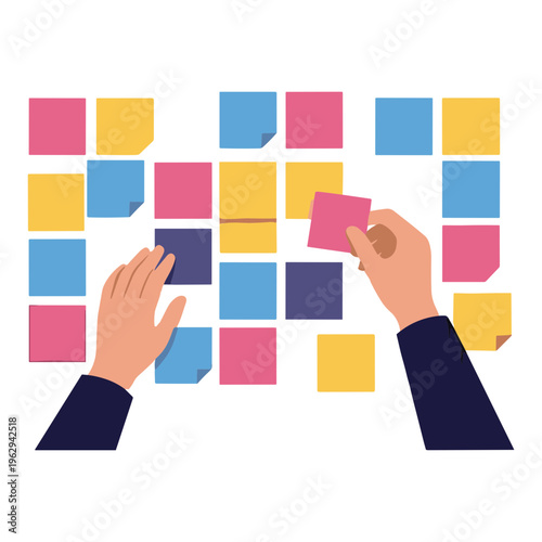Person arranging colorful sticky notes on a wall with hands