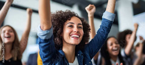 Celebrating Success A Joyous Team Embraces Achievement with Smiles and Enthusiasm in the Workplace