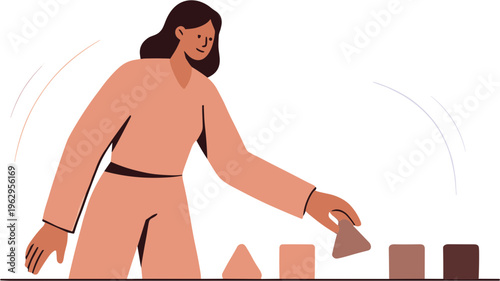 Woman arranging colorful blocks on a table in an artistic manner indoors