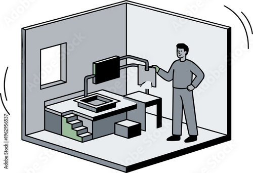 A man stands in an office cubicle examining a document near a desk.