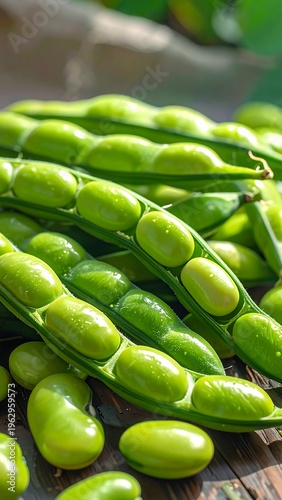 Fresh green peas in pods on wooden surface