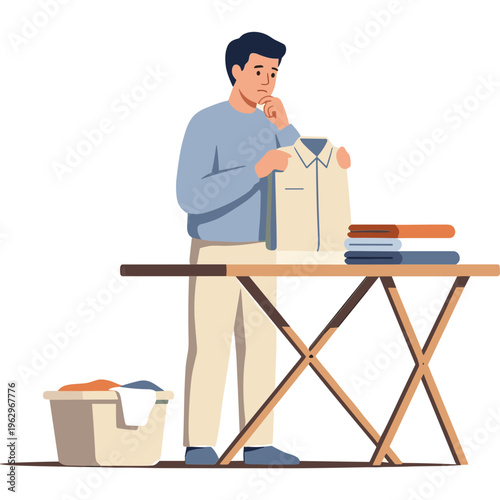 Man standing at ironing board with laundry thinking about folding clothes