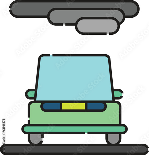 A green car drives under a gray windmill on a road