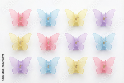 Colorful butterfly hair clips arranged neatly on a white background