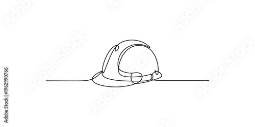 Continuous line drawing of a simple cap or hat on a flat surface one single