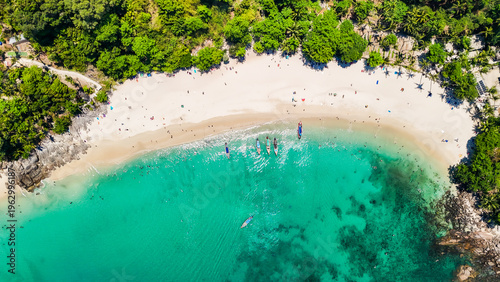 Stunning aerial view of the beach. An aerial photograph of the beautiful tropical beach and sea on Phuket Island. Located at Freedom Beach, Phuket, Thailand, at 10 am – the start of sunbathing, summer
