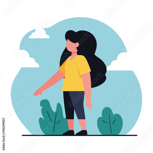 A woman in a yellow shirt and dark pants stands outdoors