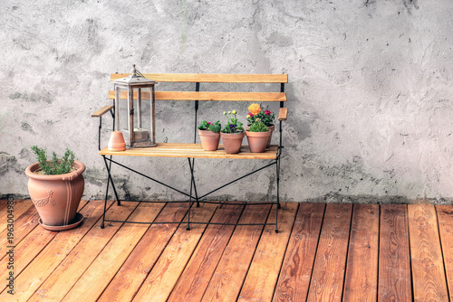 front of view on front of view on bench against the textured gray wall of a w...