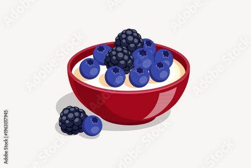 Healthy yogurt bowl with fresh blueberries and blackberries on top.