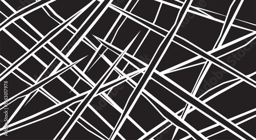 Bold abstract background featuring a chaotic composition of overlapping sharp geometric shapes and lines in a stark black and white palette.