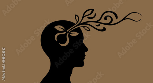 Silhouette of a human head with creative ideas flowing out.