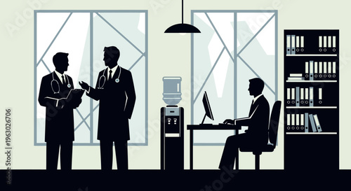 Office workers collaborating and working on computers.