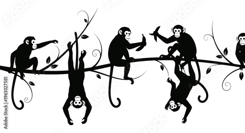 Silhouette of playful monkeys swinging on tree branches.