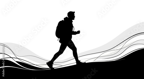 Silhouette of a hiker with a backpack walking uphill.