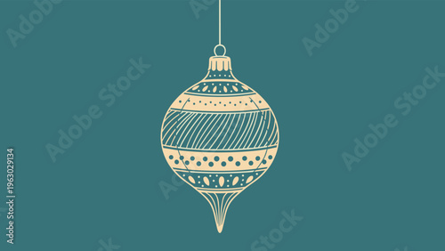 Decorative Christmas bauble ornament with intricate patterns hangs on a string against a solid teal background.